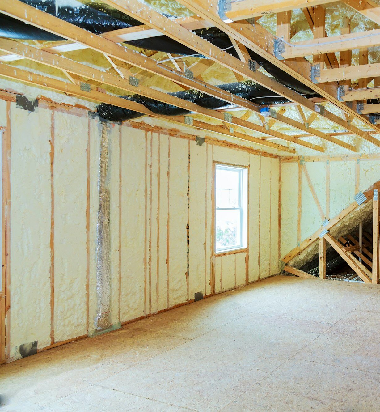 Heat isolation in a new prefabricated house with mineral wool and wood.